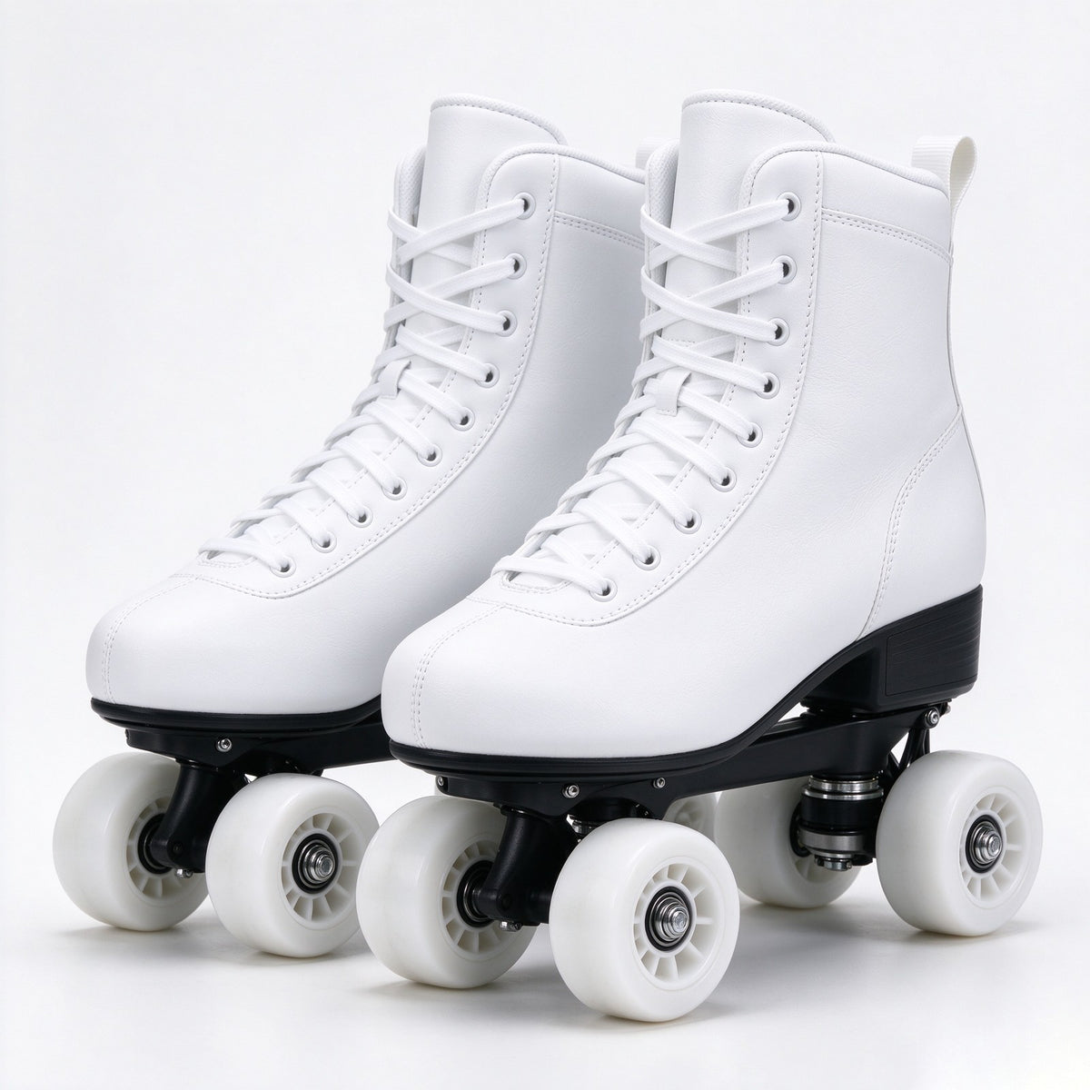 Pair of white quad skates on a plain studio background