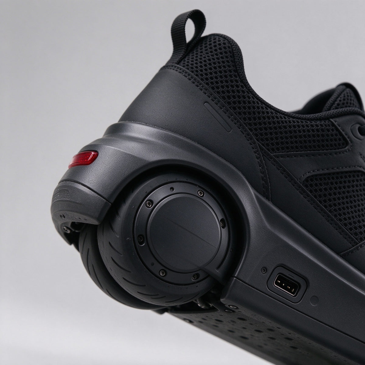 Detail of the motorised heel wheel and charging socket